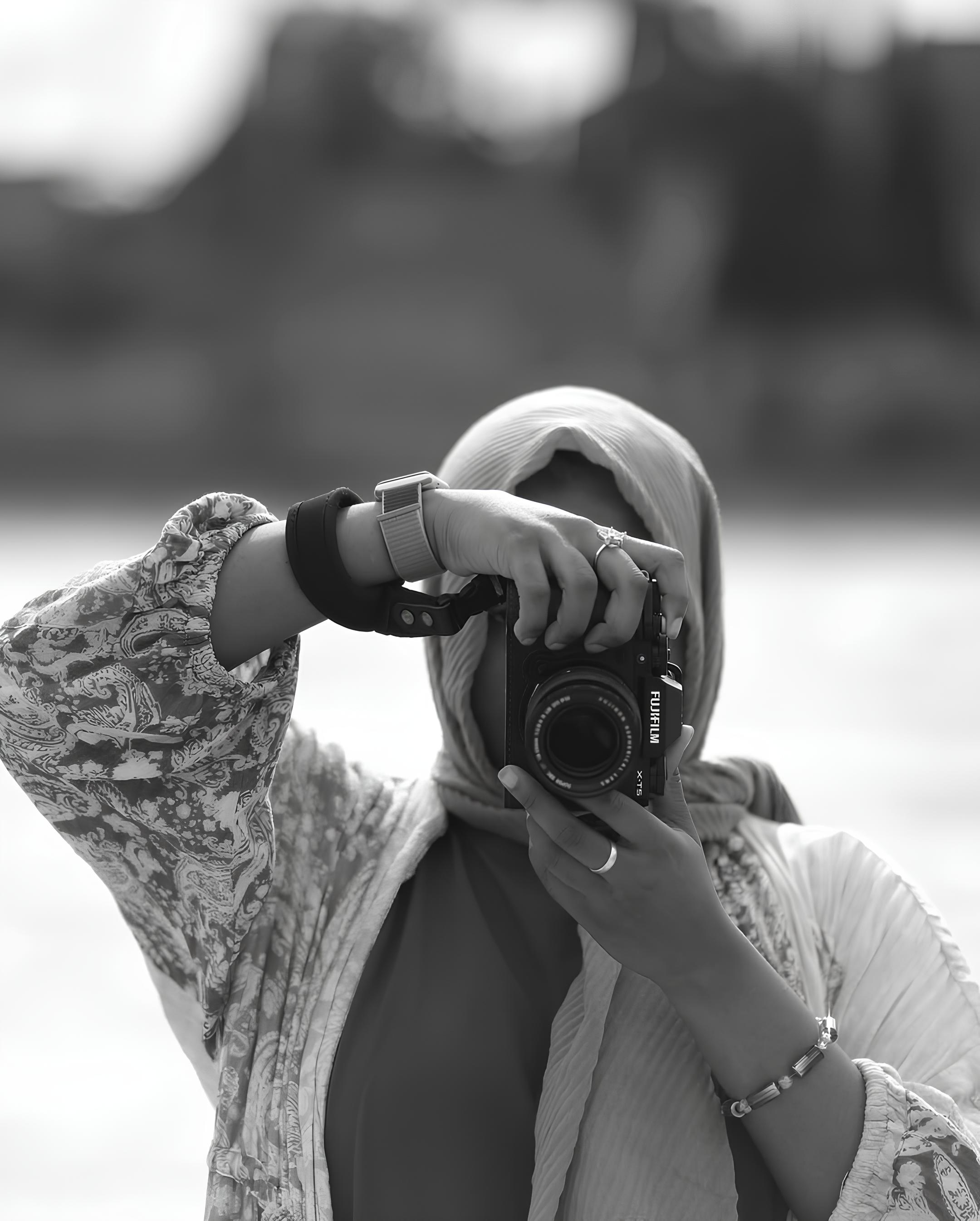 Iklima Babangida photographing architectural arches inside a grand mosque